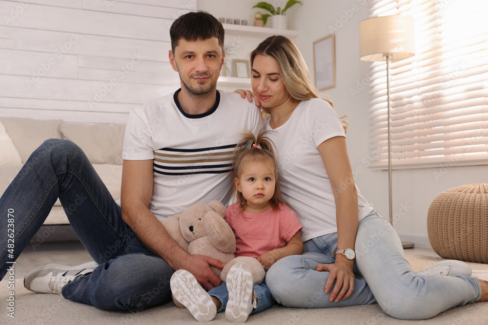 Family with little daughter spending time together at home Family with little daughter spending time together at home
