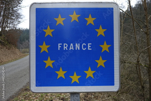 Blue road sign with the EU flag and 'FRANCE' in white capitals, German French border (horizontal), Lembach, Bas Rhin, Grand Est, France