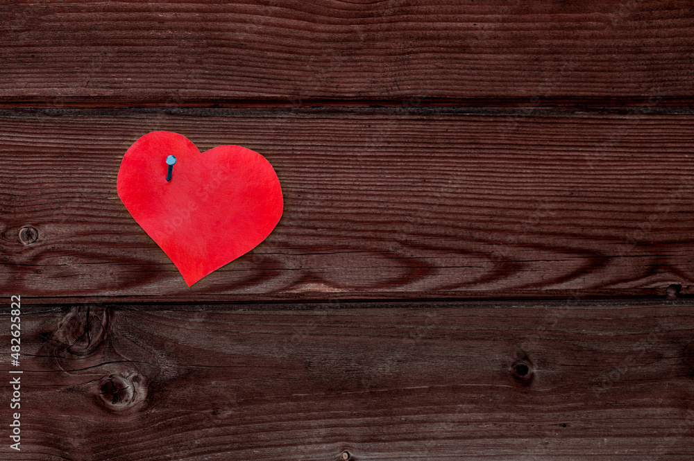paper heart on a wooden surface paper heart on a wooden surface