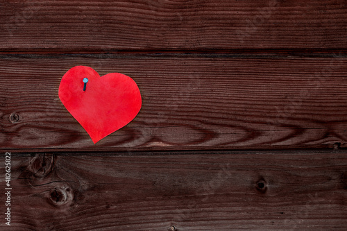 paper heart on a wooden surface