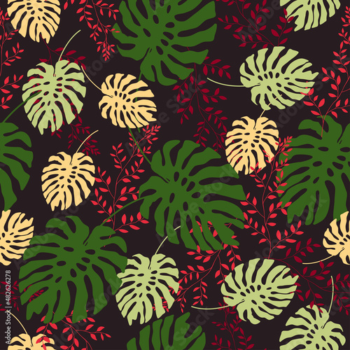 Fashionable seamless floral pattern. Pink, green and red leaves on a black background. Hand-drawn vector illustration.