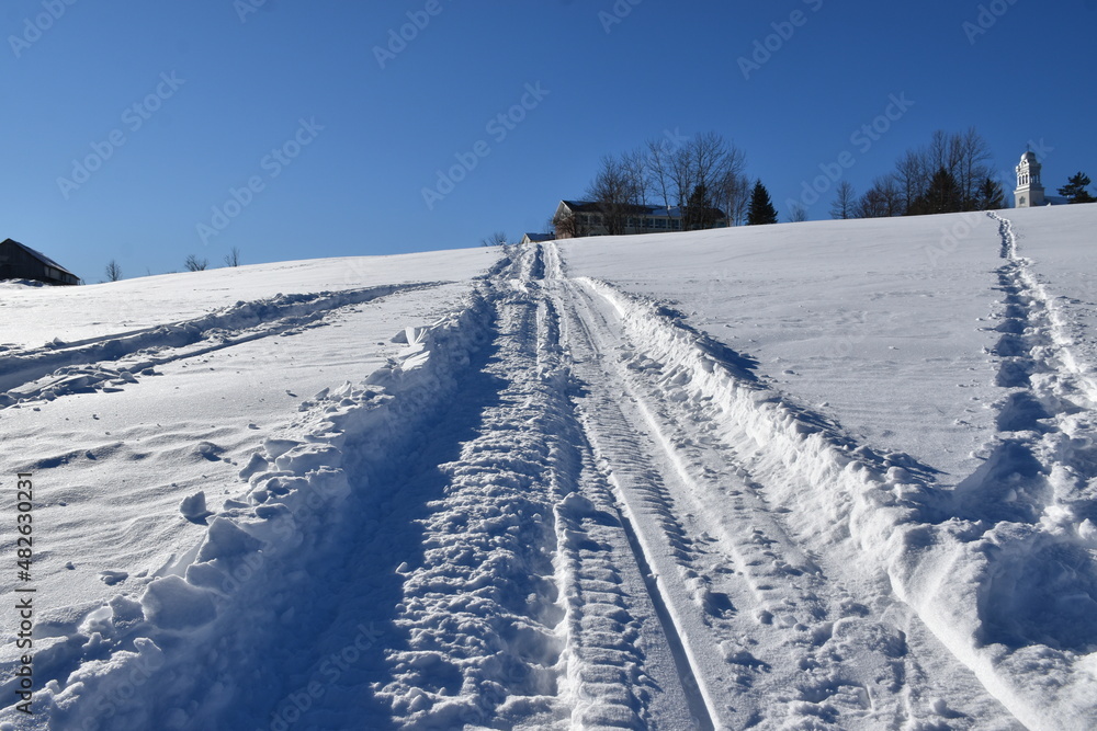 A snowmobile trail under a blue sky, Sainte-Apolline, Québec, Canada