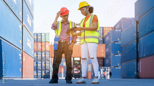 Woman inspector or Safety Supervisor and Old delivery man in Container cargo CustomTerminal port concept import export transportation and logistic service
