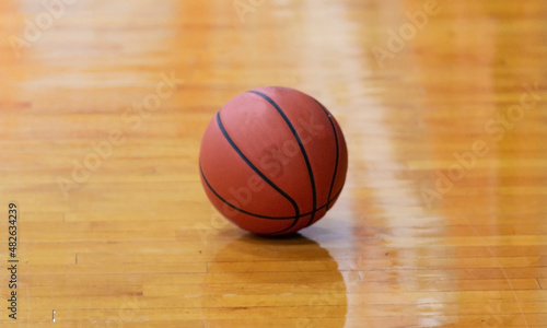 Basketball isolated on a gym floor © coachwood