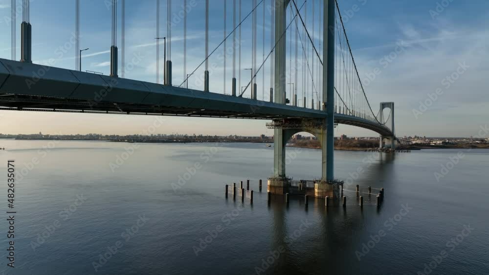 daytime descending shot of Bronx Whitestone Bridge in NYC daytime descending shot of Bronx Whitestone Bridge in NYC