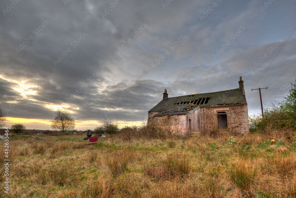 Remote countrtyside with long abandoned derelict cottage. 