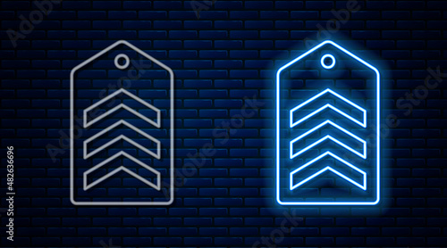 Glowing neon line Chevron icon isolated on brick wall background. Military badge sign. Vector