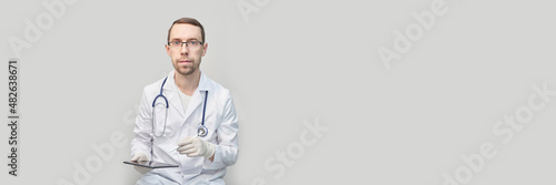 Doctor using tablet. Hospital electronic device. Online patient examination. Safety casual consultation. Business medic presentation. Service person portrait