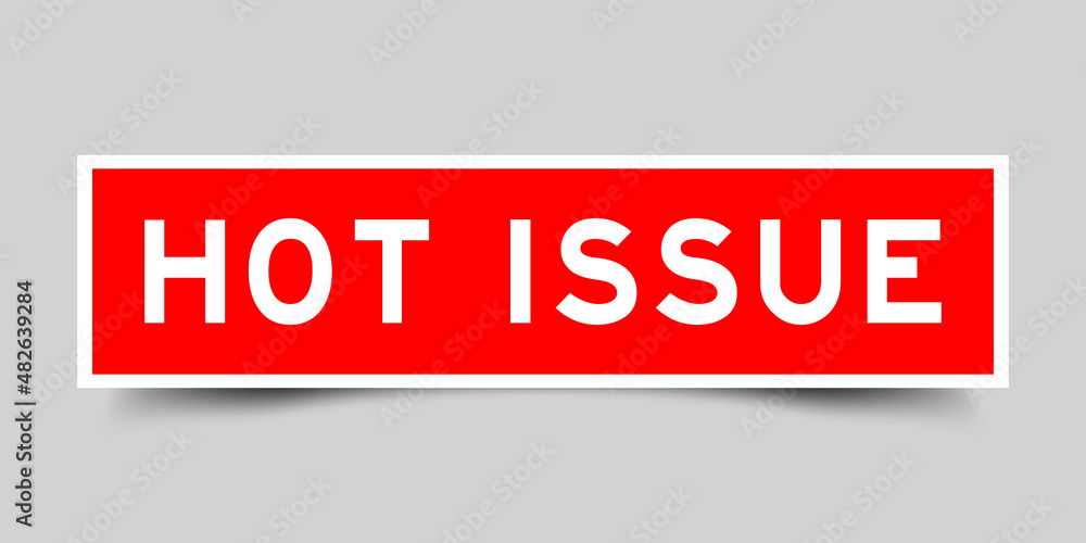 Sticker label with word hot issue in red color on gray background Sticker label with word hot issue in red color on gray background