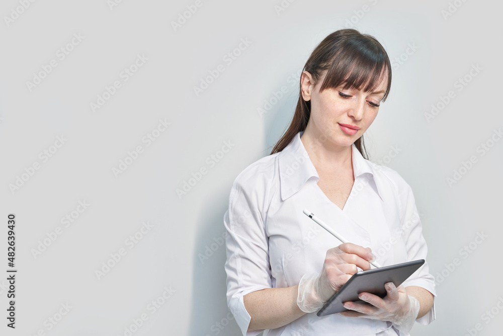 Doctor using tablet. Hospital electronic device. Online patient examination. Safety casual consultation. Business medic presentation. Service person portrait Doctor using tablet. Hospital electronic device. Online patient examination. Safety casual consultation. Business medic presentation. Service person portrait