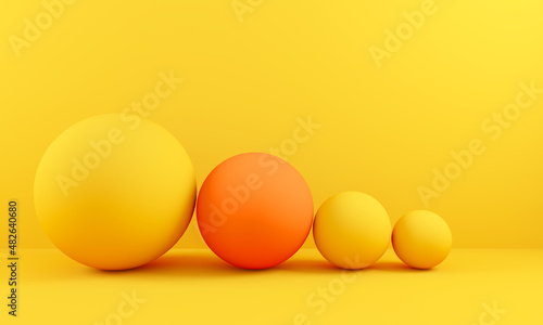 4 spheres arranged from largest to smallest
one in different orange color business balance and marketing strategy concept. 3d render