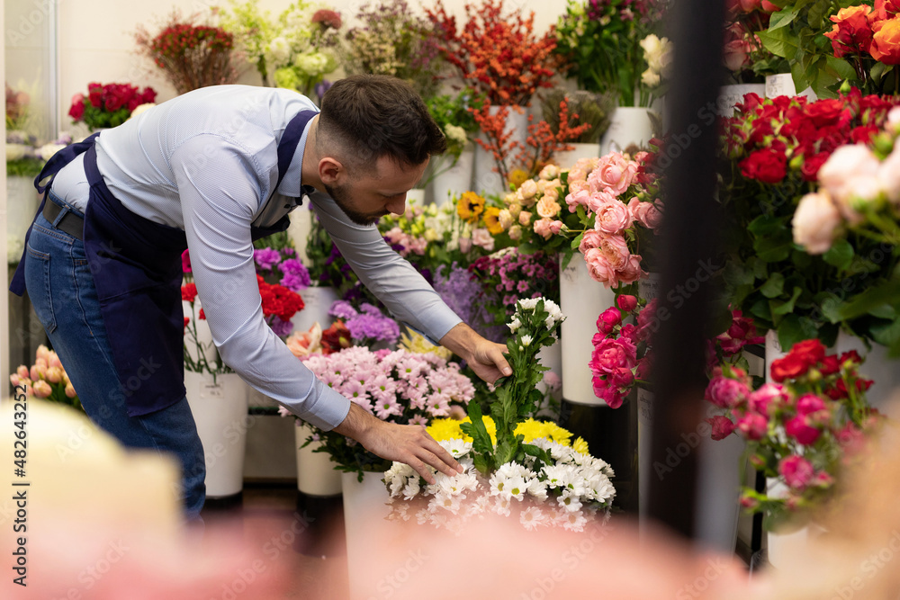 a florist among the flowers in the refrigerator cleans up the upcoming sales for International Women's Day a florist among the flowers in the refrigerator cleans up the upcoming sales for International Women's Day