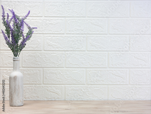 Fototapeta Naklejka Na Ścianę i Meble -  Lavender flowers in a pot, on a light background