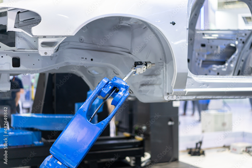 Robot arm working in car factory Robot arm working in car factory
