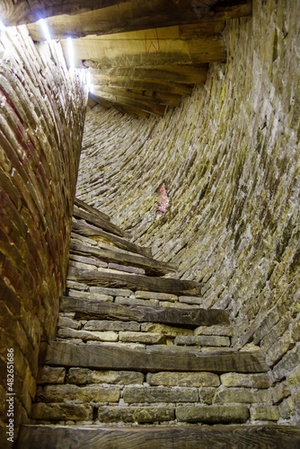 Steps leading upwards in a spiral direction. Shot in the minaret of Islam Khodja, Khiva, Uzbekistan photo