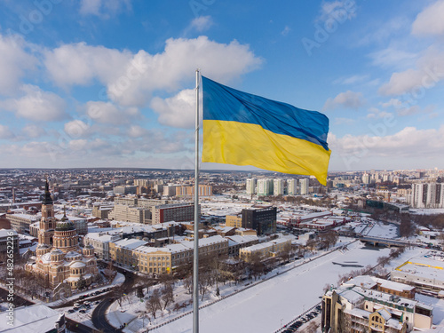 Ukrainian flag in the wind. Blue Yellow flag in the city of Kharkov photo