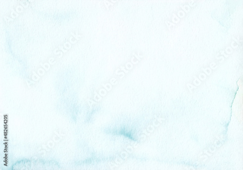 Watercolor pastel sea blue background texture. Light cyan blue stains on paper, hand painted.