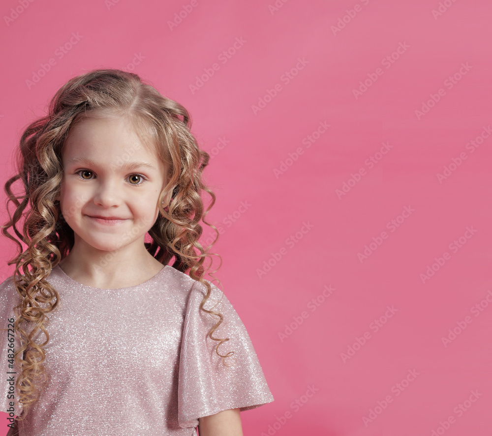 Blonde with curly hair close-up on pink background Blonde with curly hair close-up on pink background