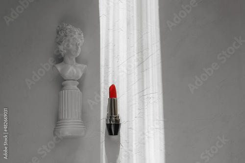 Red lipstick on a white textured background