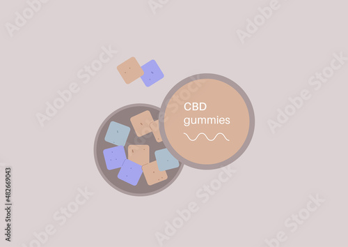 A round box with colorful pastel CBD candies infused with legal recreational weed