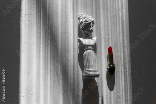 Red lipstick on a white textured background