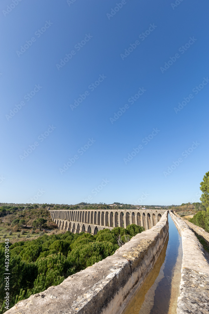 Tomar Aqueduct or Aqueduto de Pegoes, ancient stone masonry building, amazing monument. It was built in the 17th century to bring water to the convent of Christ in Tomar under command of king Philip I