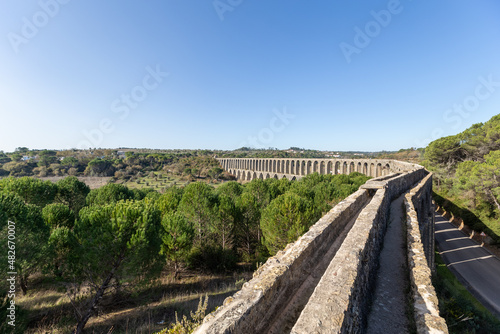Tomar Aqueduct or Aqueduto de Pegoes, ancient stone masonry building, amazing monument. It was built in the 17th century to bring water to the convent of Christ in Tomar under command of king Philip I photo