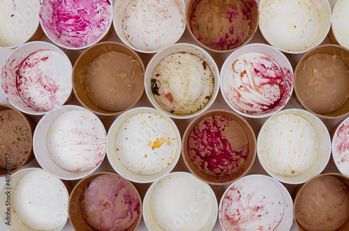 Dirty used disposable bowls on a light background. Unsustainable concept