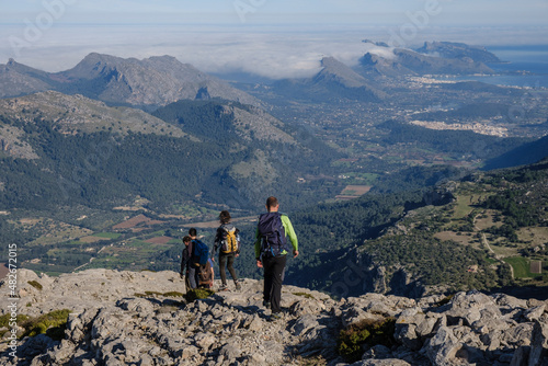 hikers descending the Puig Tomir towards Fartaritx,, Mallorca, Balearic Islands, Spain