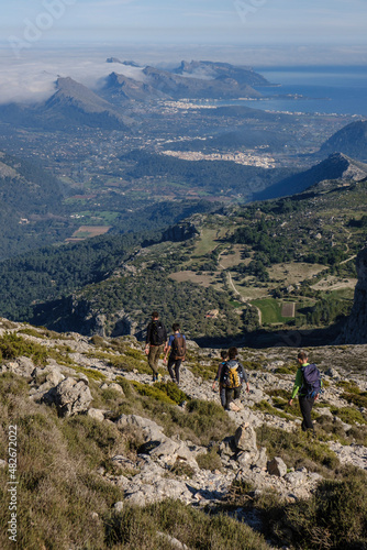 hikers descending the Puig Tomir towards Fartaritx,, Mallorca, Balearic Islands, Spain photo