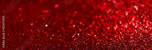 Red hearts, sparkling glitter bokeh background texture. Holiday valentines day lights. Abstract defocused header. Wide screen wallpaper. Panoramic web banner with copy space for design