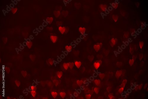 Red hearts  sparkling glitter bokeh background  valentines day abstract defocused texture