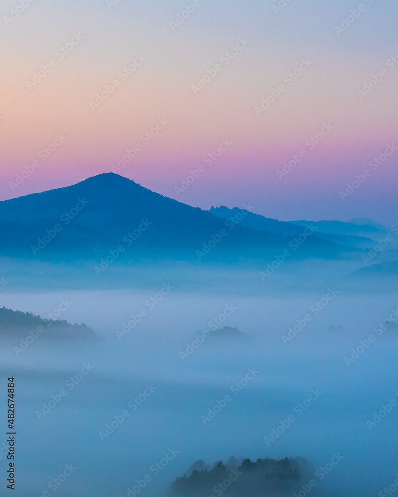 Beautiful arial landscape of  amazing mountain in fog.