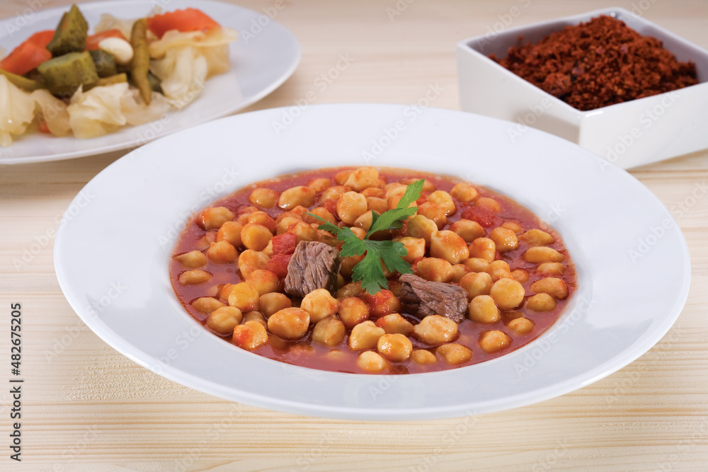 Turkish Kuru Fasulye food with Traditional Turkish table with decoration Turkish Kuru Fasulye food with Traditional Turkish table with decoration
