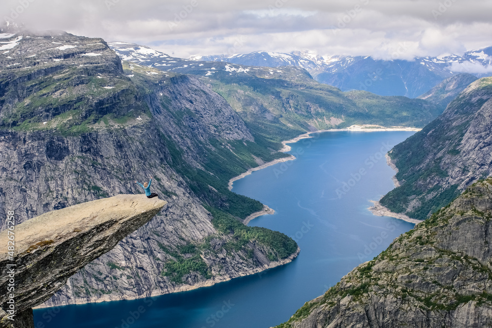 Sitting woman on the edge of a rock Sitting woman on the edge of a rock