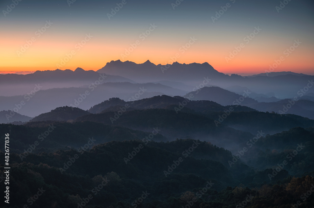 Scenery of Doi Kham Fah viewpoint with sunrise over Doi Luang Chiang Dao mountain with foggy in tropical rainforest at national park