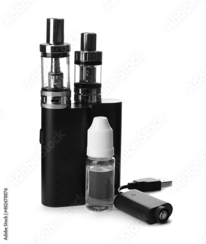 Electronic smoking devices, vaping liquid and charger on white background