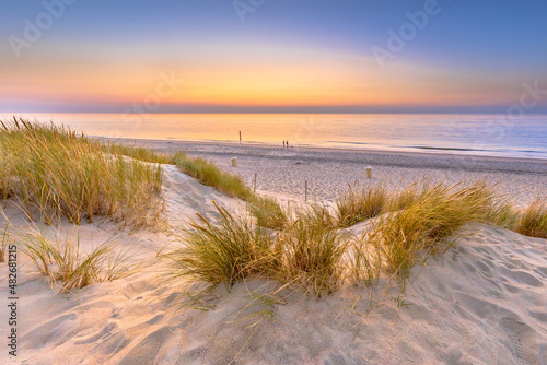 Fototapeta Naklejka Na Ścianę i Meble -  Sunset View over ocean from dune in Zeeland