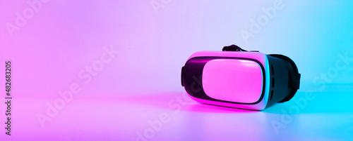 VR headset virtual reality. 3d digital glasses on futuristic neon tech background. Innovation device, cyberspace technology.