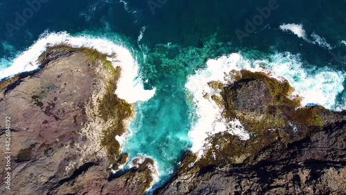 Sea and waves crash against the rocks of the coast, Gran Canaria from a drone.