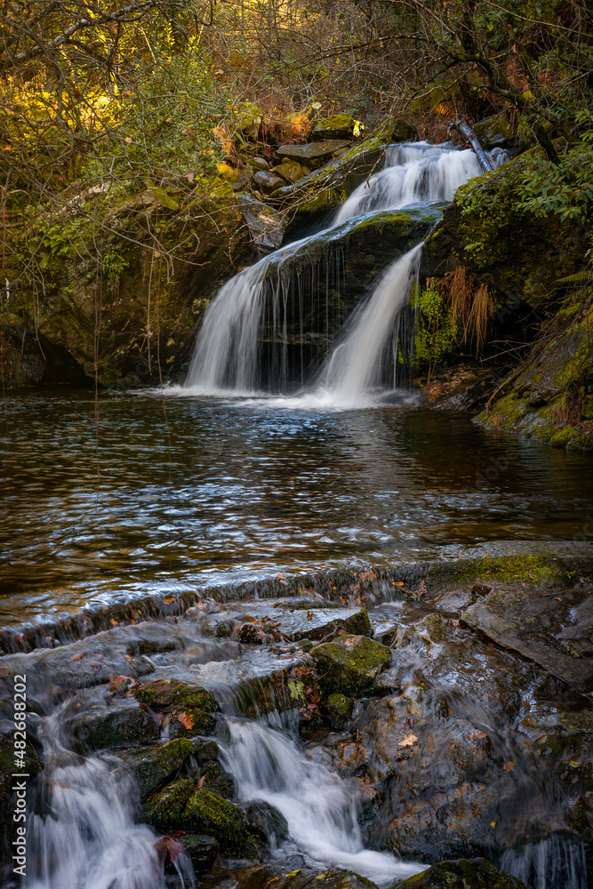 Magical waterfall on a tree nature landscape in Mondim de Basto, Portugal Magical waterfall on a tree nature landscape in Mondim de Basto, Portugal