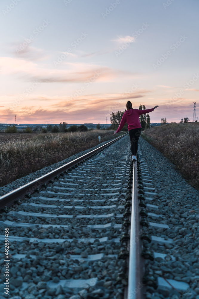 woman walking the train lives