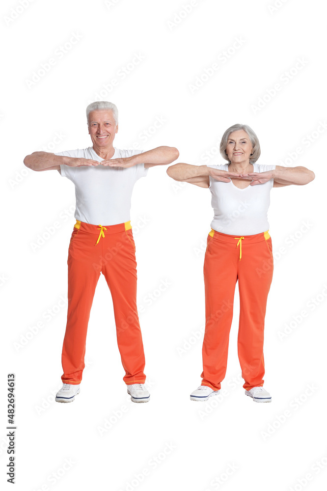 Senior couple exercising isolated on white background Senior couple exercising isolated on white background