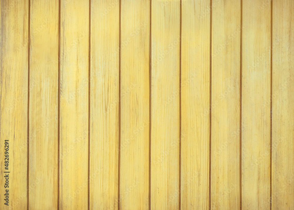 Fototapeta premium Yellow wood color texture vertical for background. Surface light clean of table top view. Natural patterns for design art work and interior or exterior. Grunge old white wood board wall pattern.
