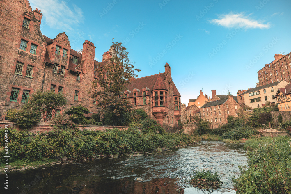 Dean Village by the Water of Leith in Edinburgh the most iconic building in the village in Edinburg, can find a beautiful oasis site of water mills with beautiful, old brick buildings