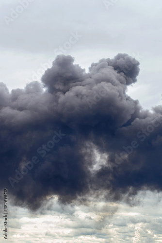 dangerous cloud of black smoke close up as background