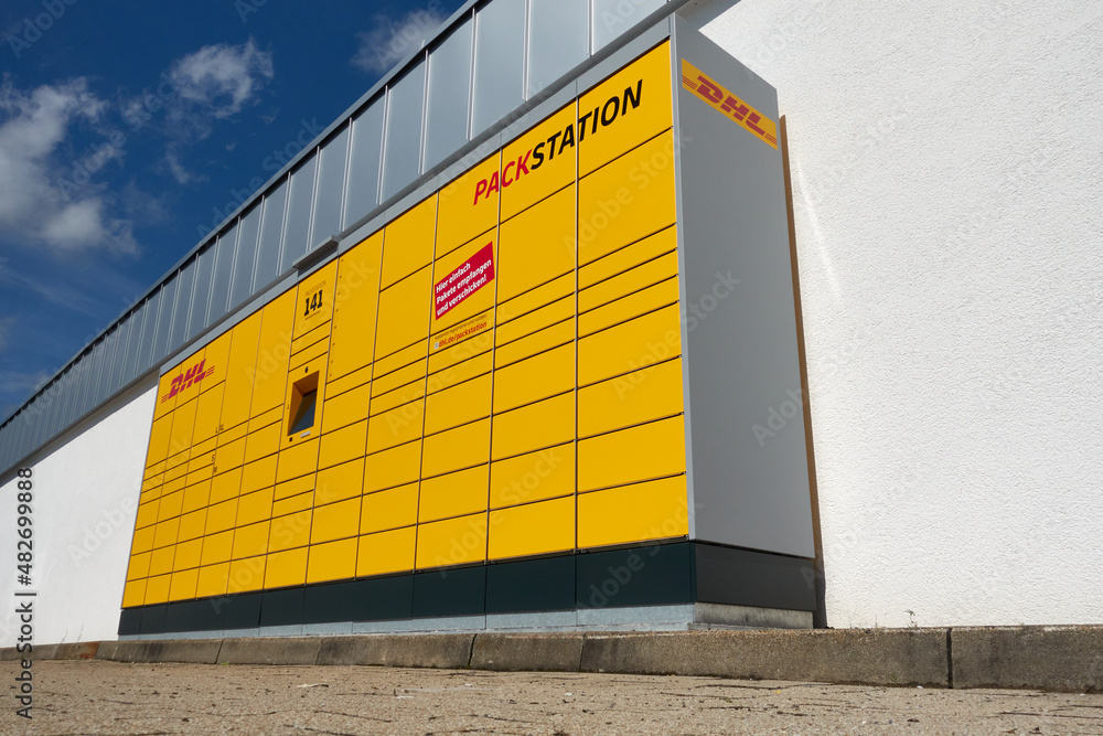 Parcel Machine Inpost Dhl parcel machine also Packstation. On the outside of a supermarket. A ...