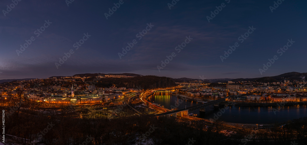 Fototapeta premium View from Vetruse building over Usti nad Labem city in evening after sunset