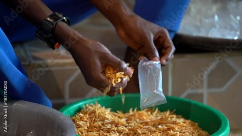 african man preparing street food for sale