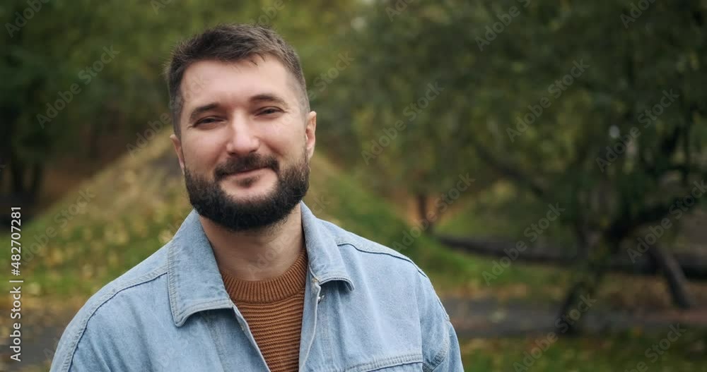 Portrait of handsome man smiling at park Portrait of handsome man smiling at park